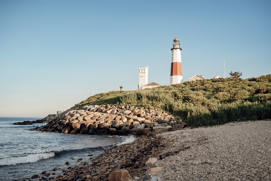 The Montauk Point Lighthouse above a rocky beach